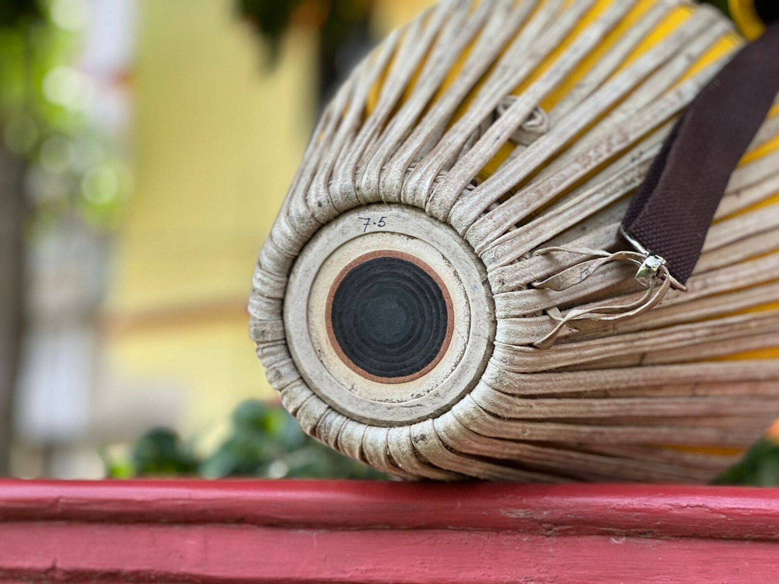 A Gauḍīya mṛdaṅga in warm devotional light